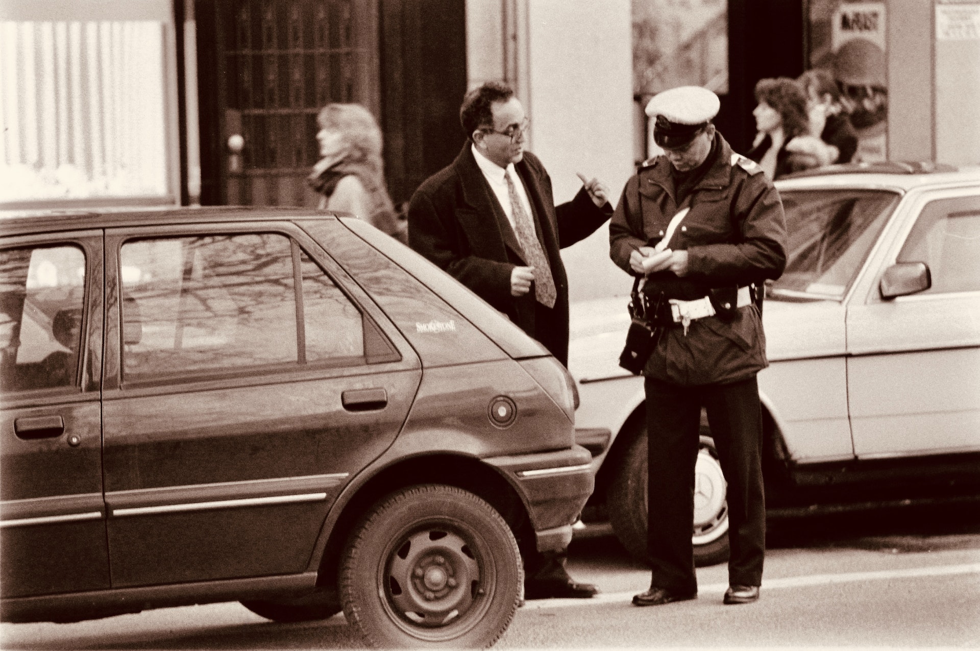Photo by Emmanuel Codden: https://www.pexels.com/photo/police-officer-writing-a-parking-ticket-15794745/